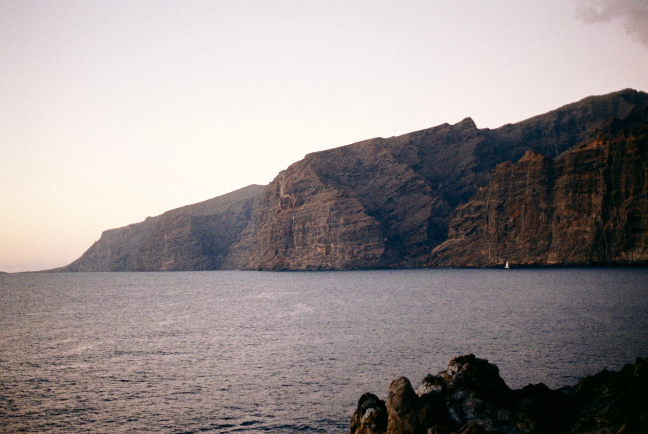 The cliffs of Los Gigantes dropping into the sea on Tenerife’s west coast in soft evening light