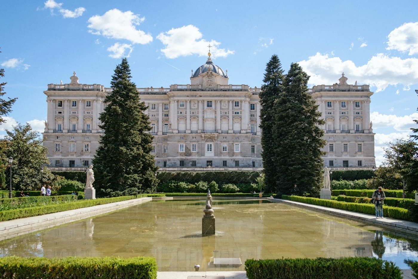 The Royal Palace of Madrid above its formal gardens and pond