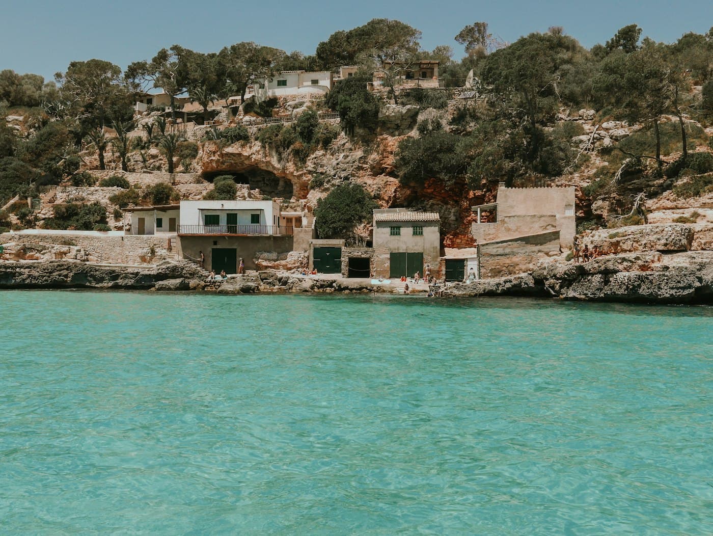 Old fishermen's houses above a turquoise cove in Mallorca