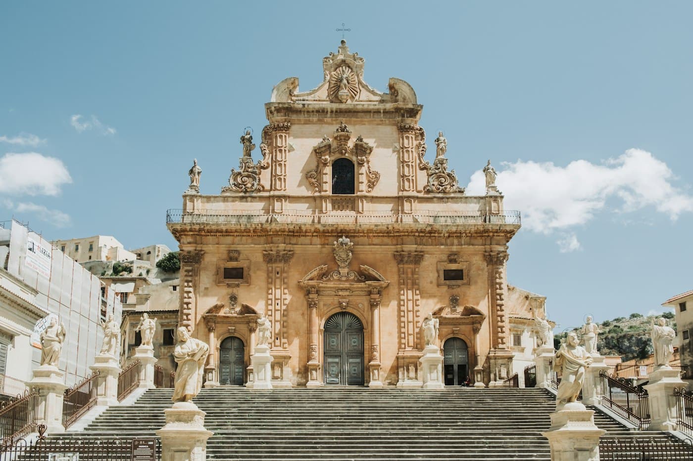 A baroque church at the top of a long stairway in Modica