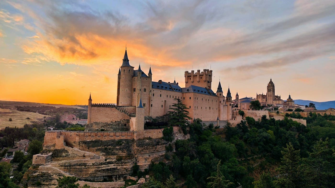 Segovia's castle on its rock at sunrise