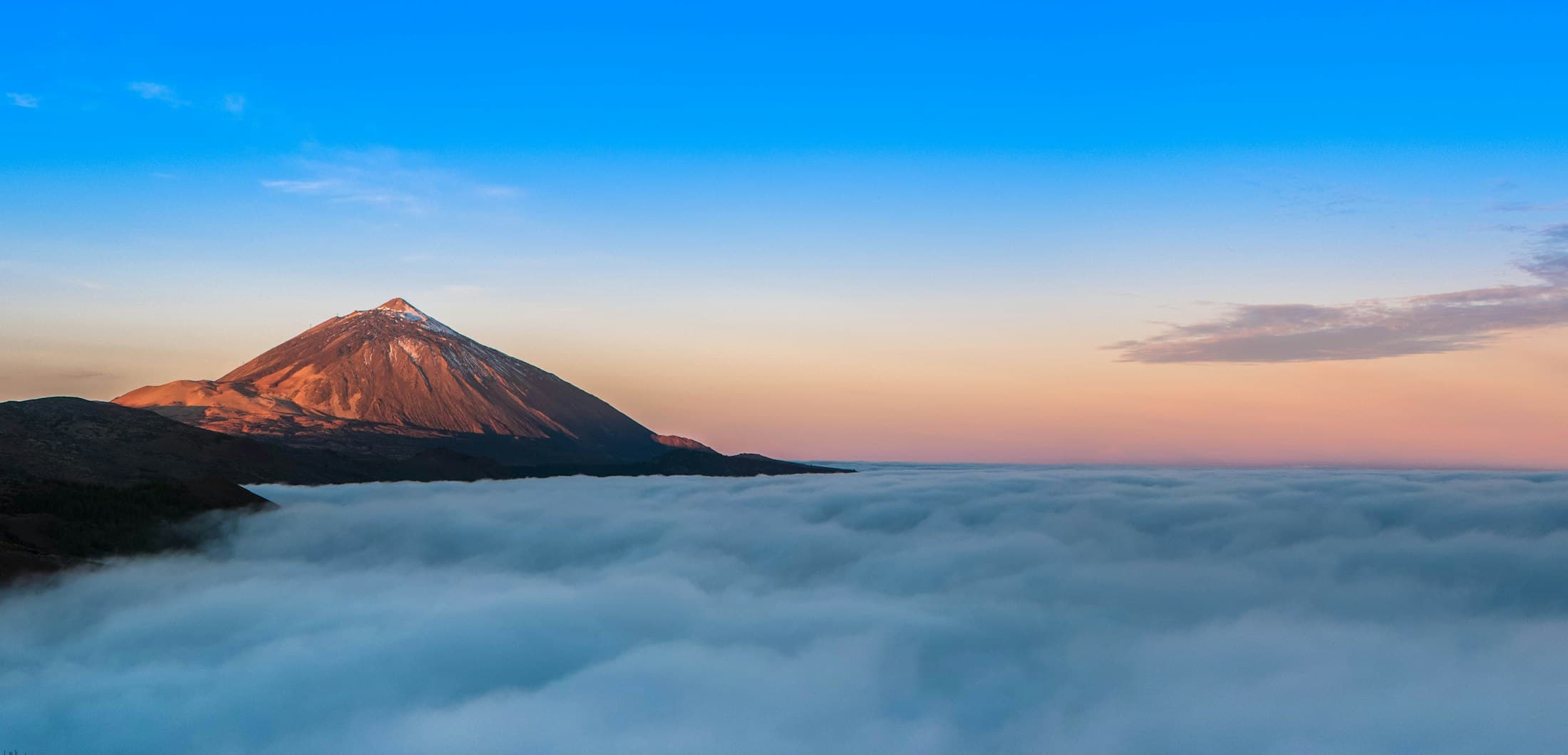 Mount Teide above a sea of clouds at sunrise, Tenerife
