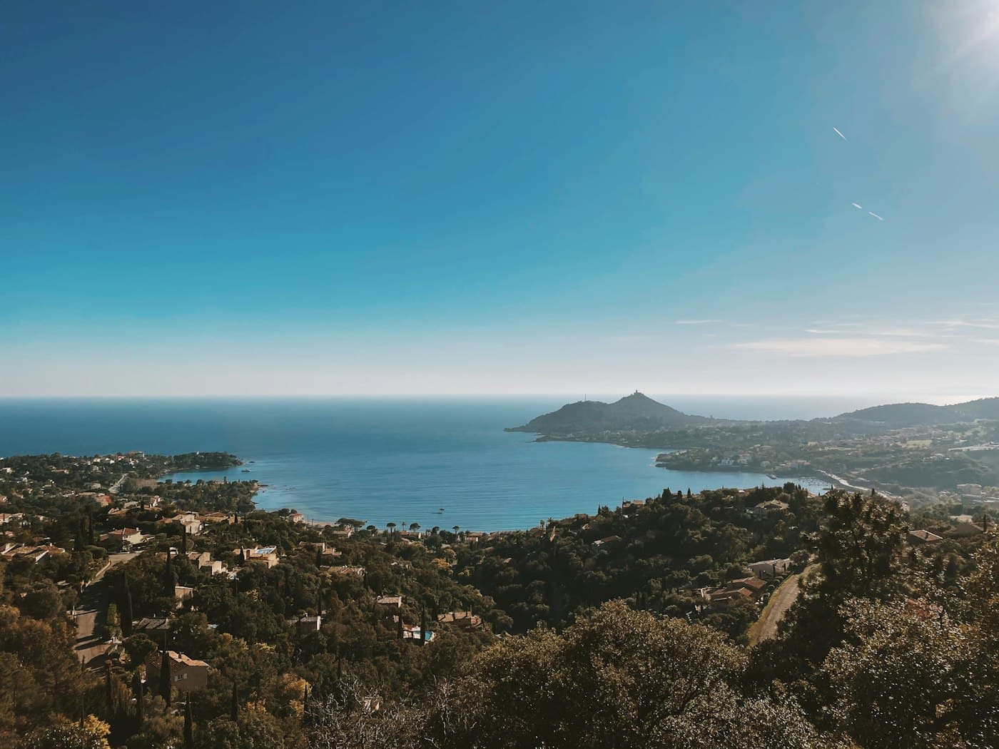 The bay of Agay from the wooded hills, villas among the pines and Cap Dramont across the water