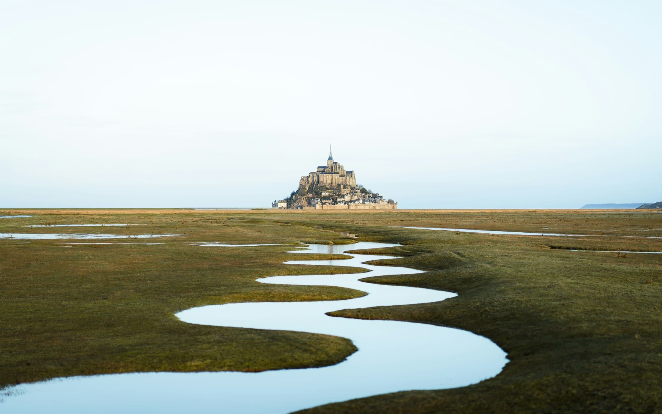 Mont-Saint-Michel beyond the salt meadows and winding tidal channels